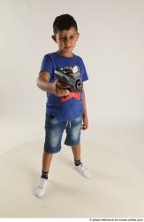 TIMBO STANDING POSE WITH GUN